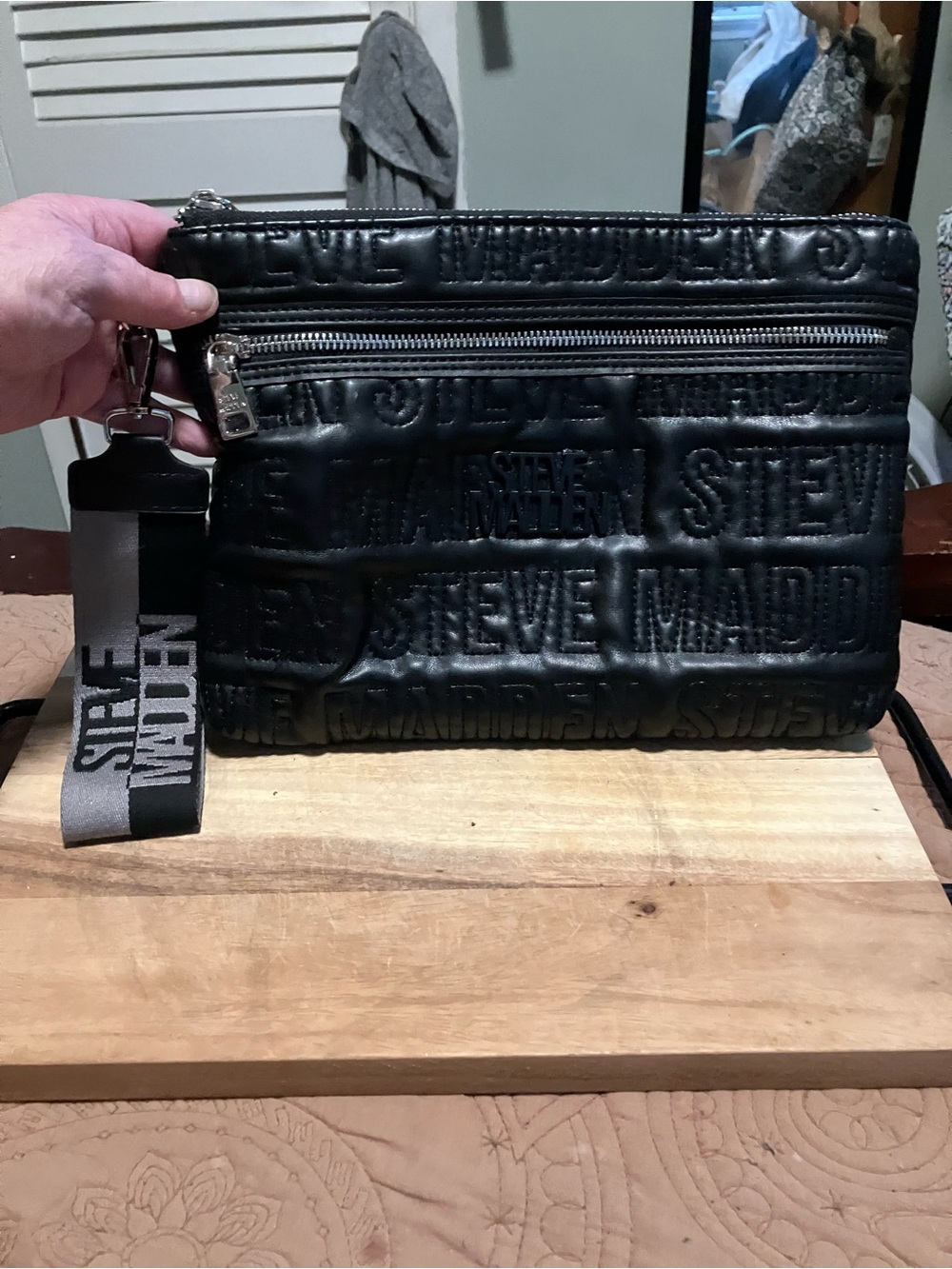 Steve Madden Black Embossed Logo Wristlet